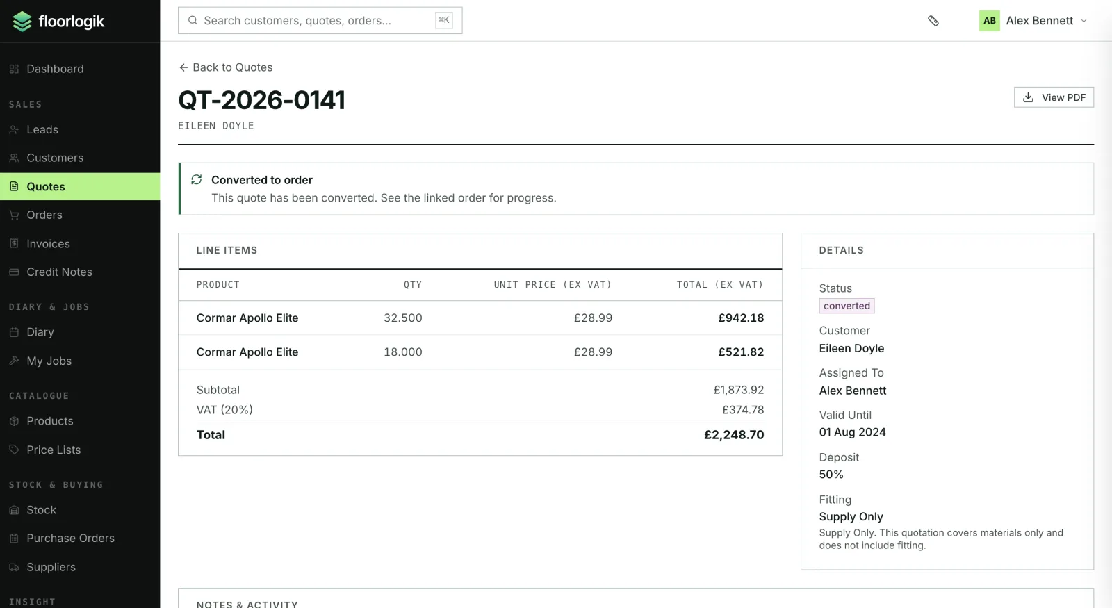 A quote in FloorLogik showing two carpet lines with quantities and prices, the VAT and total, and the customer, deposit percentage and fitting type alongside.
